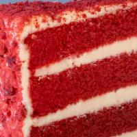 Red Velvet Cake Slice · Red velvet cake filled and decorated with a sweet cream cheese frosting, covered in cake cru...