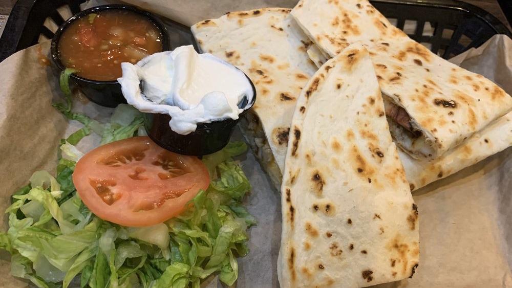 Chicken Quesadilla · Large tortilla grilled with chicken & cheese. Served with a side of salsa & sour cream.