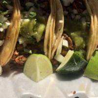 Tacos (6) · Served with onion, cilantro, radish, lime and homemade tomatillo sauce. 
Add rice and beans ...