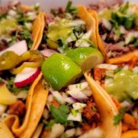 Tacos (2) · Served with onion, cilantro, radish, lime and homemade tomatillo sauce. 
Add rice and beans ...