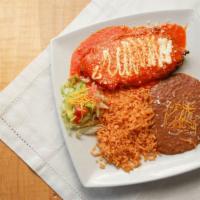 Chile Relleno Authentico · Toasted poblano pepper filled with Monterey cheese and fried in egg white batter topped with...