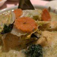 Green Curry · Green curry pasted cooked with mixed vegetables and basil leaf in coconut milk.