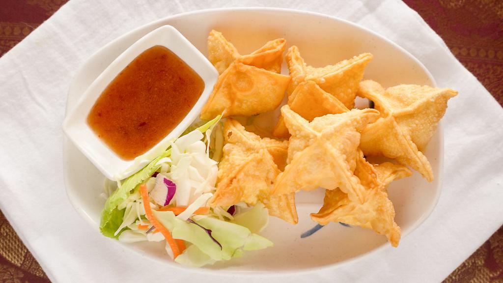Crab Puff (6) · Deep fried stuffed wonton with cream cheese, imitation crab meat, and mixed veggies                        served with sweet chili sauce