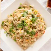 Crab Fried Rice · Pan fried rice with crab meat, egg, onion, tomato, carrot, and green peas