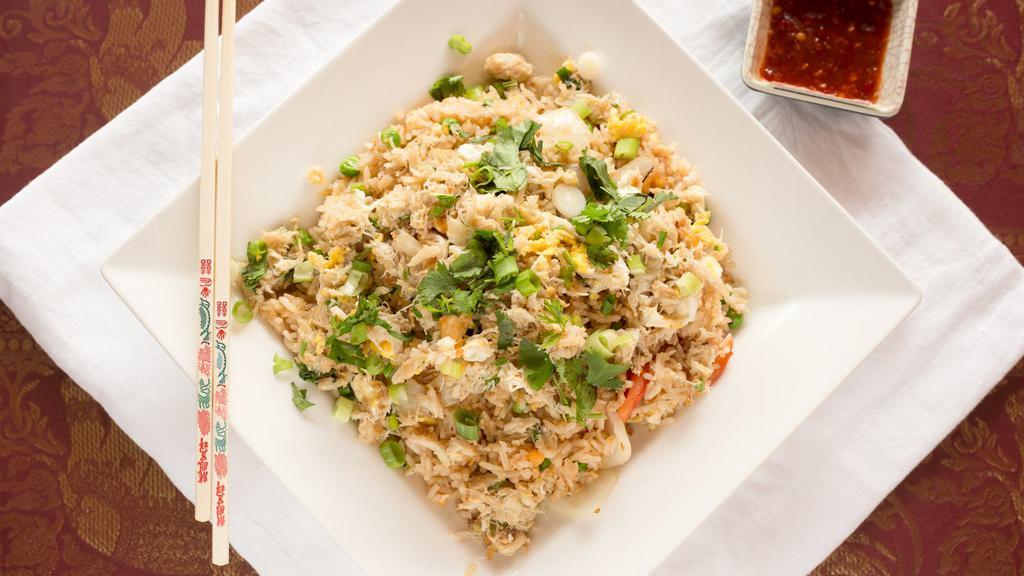 Crab Fried Rice · Pan fried rice with crab meat, egg, onion, tomato, carrot, and green peas