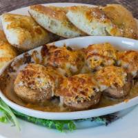 Gourmet Stuffed Mushrooms · Stuffed with herbs, provolone, mozzarella, Italian sausage and baked. Served with baked chee...