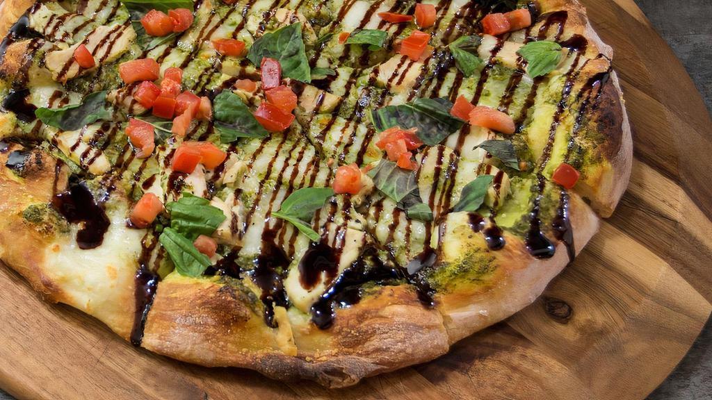 Personal Chicken Caprese · Pesto base, fresh mozzarella, minced garlic, oven-roasted chicken breast, parmesan and romano cheeses. Finished with fresh sliced roma tomatoes, fresh basil and balsamic reduction.