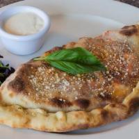 Cheesy Chicken Calzone · Oven-roasted chicken breast, ricotta, mozzarella, provolone and cheddar cheeses with bacon, ...