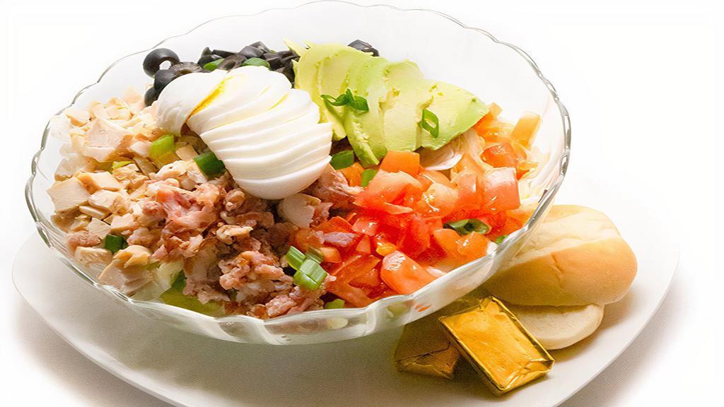 Cobb Salad · Diced chicken breast, bacon, avocado, tomatoes, bleu cheese crumbled and a hard-boiled egg.
