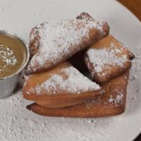 Small Beignets (5 Pieces) With Chicory Anglaise And Powdered Sugar · Pillowy golden beignets in the class French Quarter style. With powedered sugar and our chic...