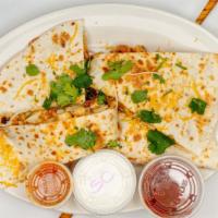 Chicken Quesadilla · Chunks of marinated chicken breast with Cheddar cheese, bell peppers, jalapeños, onions, and...