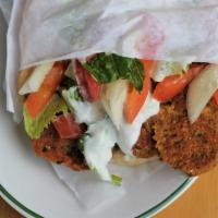 Falafel Sandwich · Fresh homemade falafel grilled in olive oil served on pita bread with vegetables and our hom...