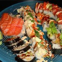 Snow Mountain Roll · Crabmeat, tempura Shrimp, spicy tuna, avocado inside, top white tuna, Masago, oba, chef's sa...