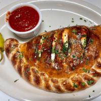 Salumi Calzone · Pepperoni , Salami, Canadian bacon and Italian sausage.. * Our Calzones come with Mozzarella...