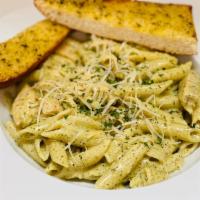 Penne Chicken Pesto · Penne noodles and sautéed chicken with creamy Pesto sauce , topped with Parmesan cheese and ...