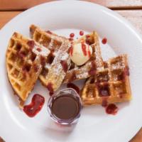 Waffles · Belgian style, pure maple or home made strawberry syrup, and whipped butter.