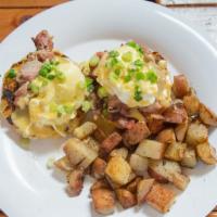 Cajun Benedict · Smoked tasso ham, over-easy eggs, and cheesy sauce, on biscuit.