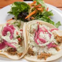 Pulled Pork Tacos · Avocado crema, queso fresco, pickled onions, pico de gallo, and served with side salad.