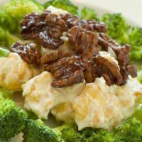 Honey Walnut Shrimp · Breaded Shrimp in creamy honey mayonnaise sauce, garnished with broccoli and topped with wal...