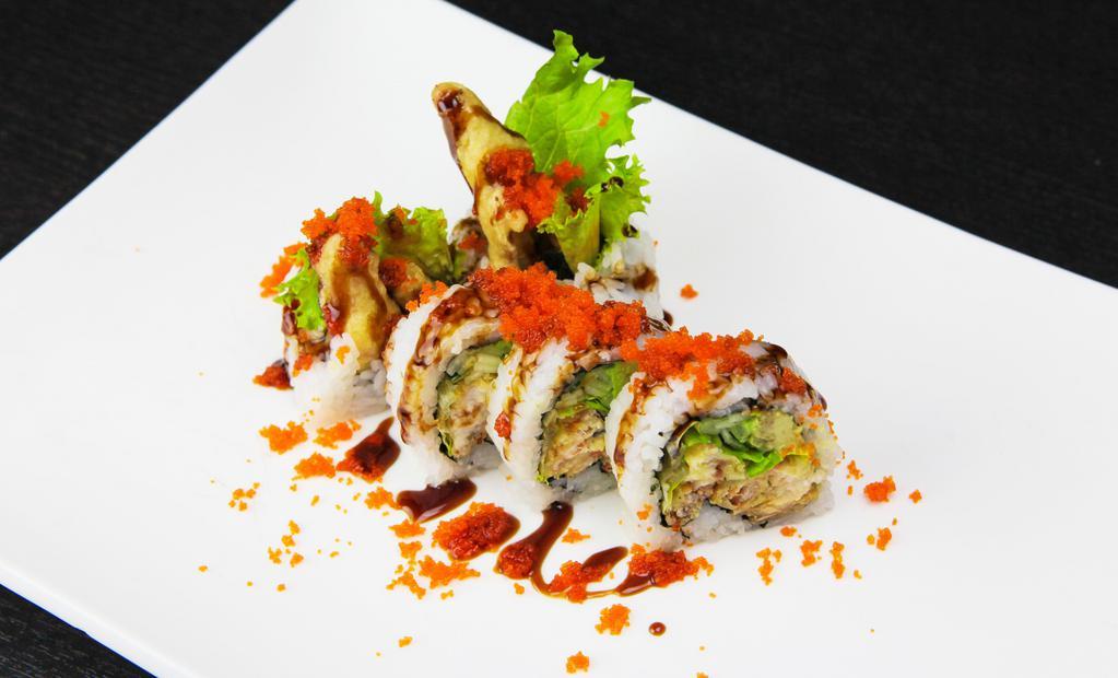 Spider Roll · Deep-fried soft shell crab, lettuce, cucumber, avocado topped with sweet eel sauce.