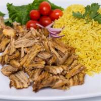 Chicken Shawarma Platter · Thinly sliced slow roasted chicken over rice, lettuce, pickles, and tahini sauce.