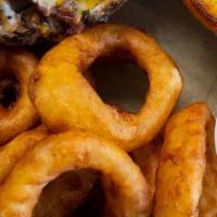 Basket Onion Rings · Beer battered onion rings with ancho ranch.