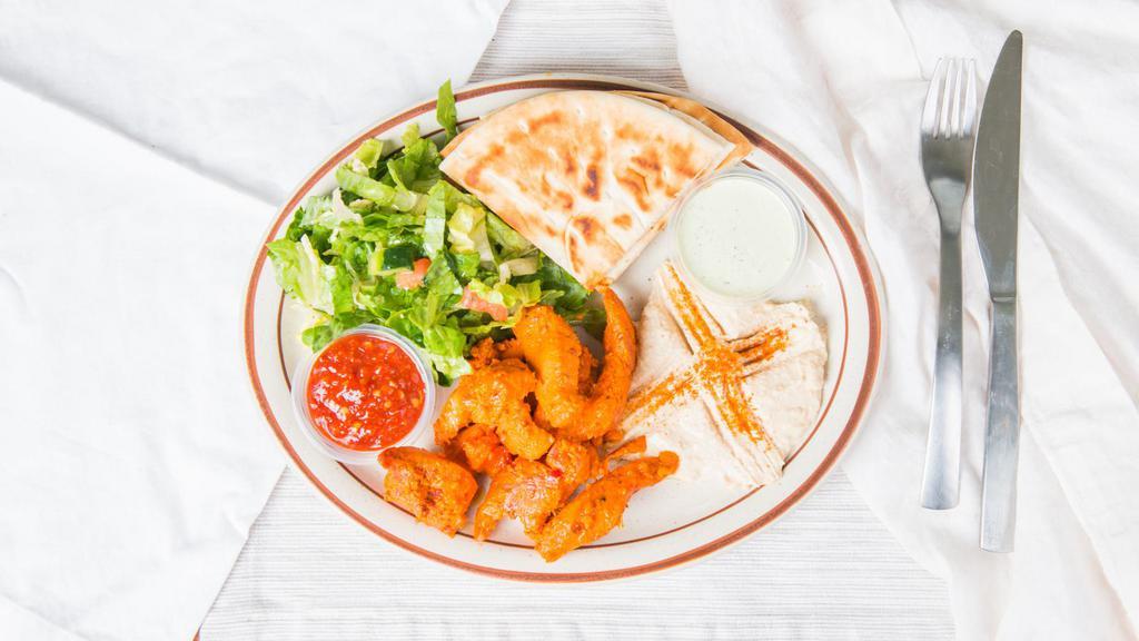 Curry Fried Chicken Plate · Served with super basmati rice veggie curry house salad and a warm pita.