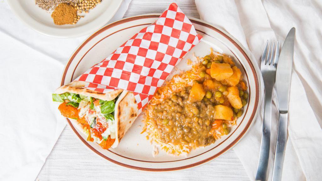 Shawarma Wrap Plate · Served with super basmati rice veggie curry house salad and a warm pita.