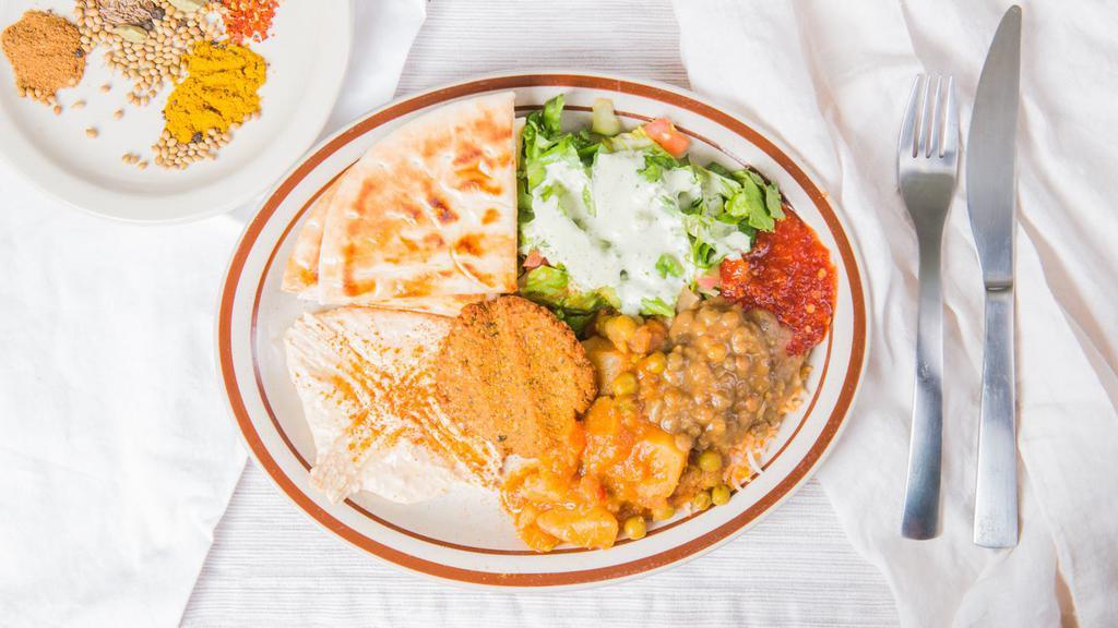 Veggie Curry Plate · Served with super basmati rice veggie curry house salad and a warm pita.