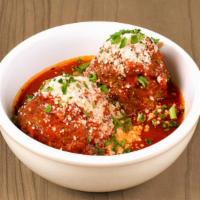 Hearty Meatballs · two hearty meatballs in marinara sauce topped with parmesan & parsley