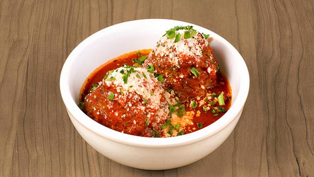 Hearty Meatballs · two hearty meatballs in marinara sauce topped with parmesan & parsley