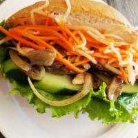 Banh Mi Baguette With Beef Less Saute · Baguette bread, lettuce, cucumber, veganaise, pickled carrots and daikon and beef less prote...