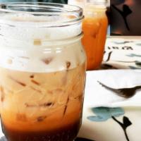 Thankful Thai Tea · Homemade sweetened thai iced tea mixed with organic vanilla soymilk. Contains caffeine.