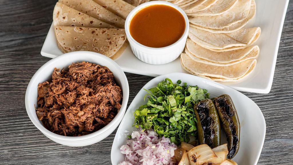 Family Pack - Shredded Beef/Birria · Includes 1 lb. Shredded Beef, 16 tortillas, taco toppings and salsa.