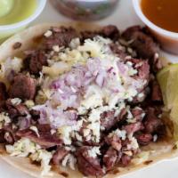 Steak Taco · Carne asada street taco lightly seasoned and topped with diced cabbage and red onion. Choice...