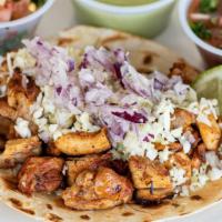 Chicken Taco · Pollo street taco marinated with citrus and anchiote seasoning. Topped with diced cabbage an...