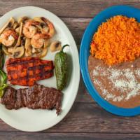 Cielo, Mar, Y Tierra · Grilled chicken, 4 prawns, and carne asada. Served with pico de gallo, fried jalapeño, guaca...