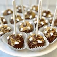 S'Mores Cake Pop · Graham cracker cake dipped in milk chocolate topped with mini marshmallows. Customization no...