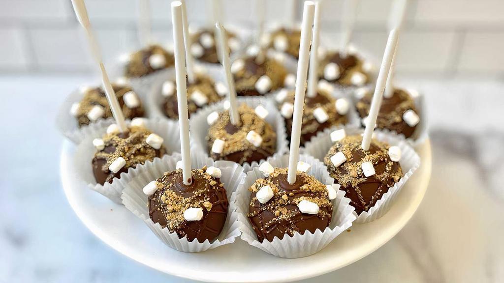 S'Mores Cake Pop · Graham cracker cake dipped in milk chocolate topped with mini marshmallows. Customization not available. Mini marshmallow toppings may be limited due to supply chain constraints.
