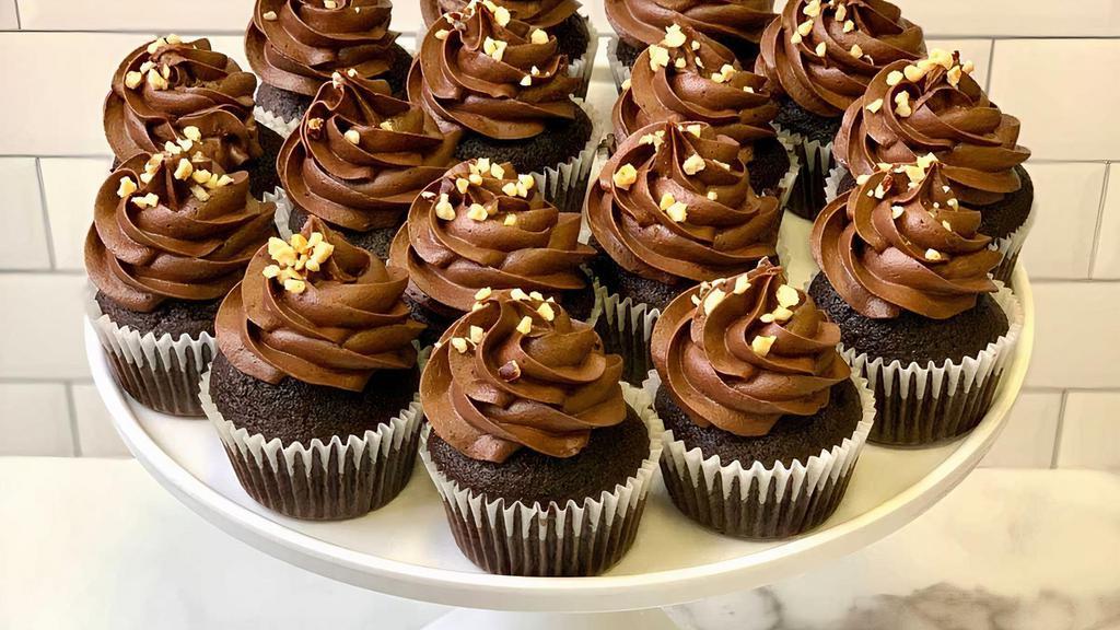 Nutella Cupcake · Our signature chocolate cupcake topped with Nutella infused chocolate buttercream topped with chopped hazelnuts. 
**CONTAINS HAZLENUTS**