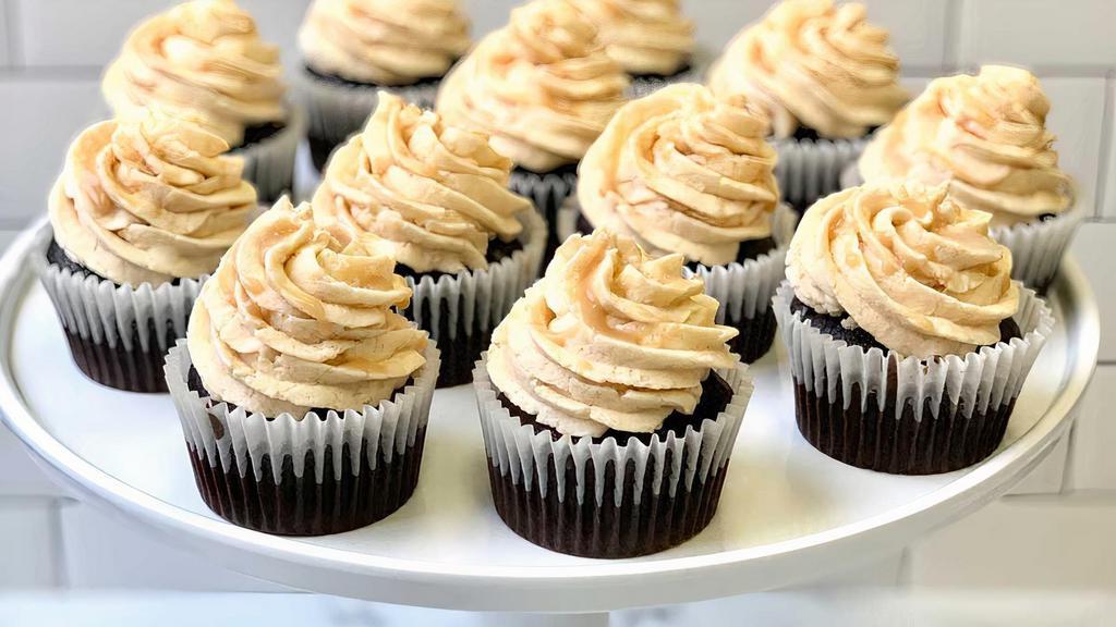 Gf Salted Caramel Cupcake · Our decadent gluten free chocolate cake topped with salted caramel buttercream drizzled with our house made caramel sauce.