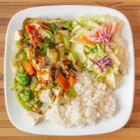 Tofu Veggie · tofu, carrots, broccoli, cabbage, spinach, steamed rice, teriyaki sauce and a side salad
