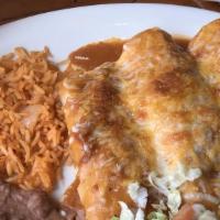 #7 Three Enchiladas (Choice Of Meat) · Served with rice and beans.