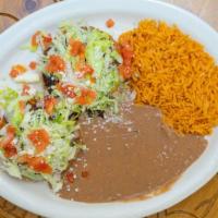 Sopes Plate · Two sopes(fried corn based masa flour with pinched sides) with refried beans and your choice...