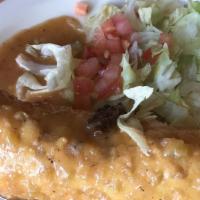 Chile Relleno · Pastry sheet filled with poblano pepper and melted cheese deep fried and smothered with gree...