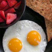 Chicky Toast · 2 eggs, 1 slice of toast, choice of berries or bacon (image: #LiveHealthy) . **Allergens: wh...