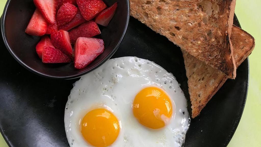 Chicky Toast · 2 eggs, 1 slice of toast, choice of berries or bacon (image: #LiveHealthy) . **Allergens: wheat, egg