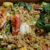 Thai Fried Rice · Fried rice with egg, tomato, onion, and choice of protein.