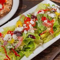Italian Chop Salad · Hearts of Romaine, salami, soppressata, banana peppers, Kalamata olives, peppadew peppers, a...