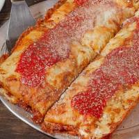 Detroit Red Top Pizza · Serves 2 to 4. Traditional Detroit pizza cooked in a blue steel pan with white Cheddar, Wisc...